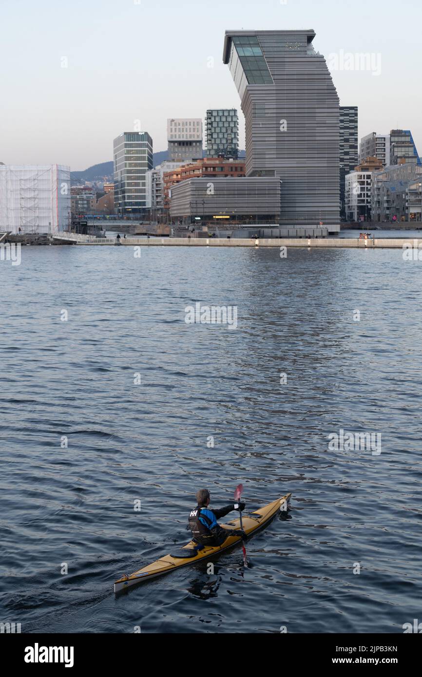 Man kayaking in Olso fjord in front of the Munch Museum Stock Photo