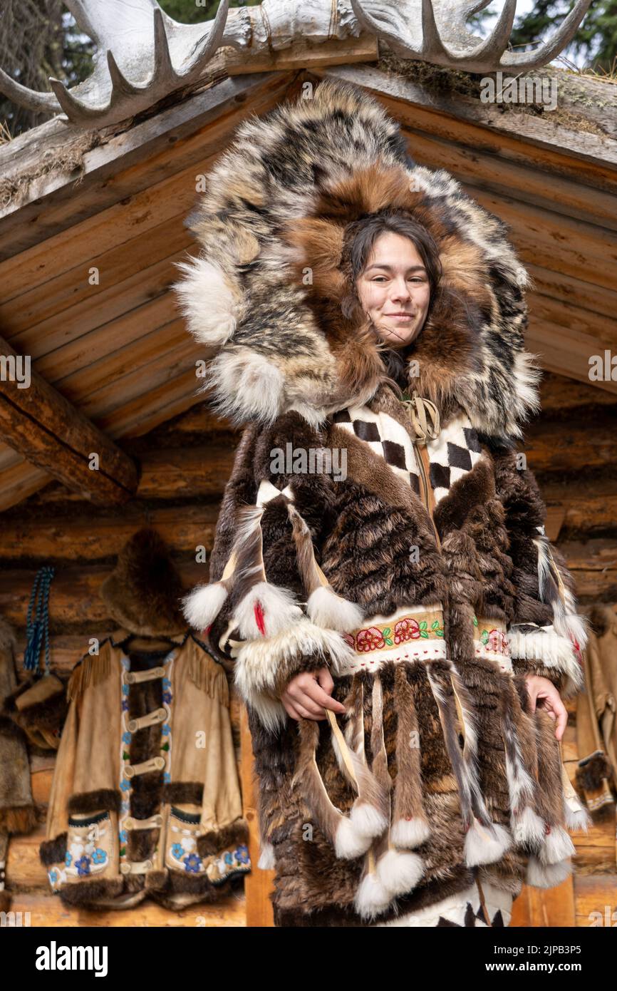An Athabaskan Girl poses in native costume at the Chena Indian Village ...