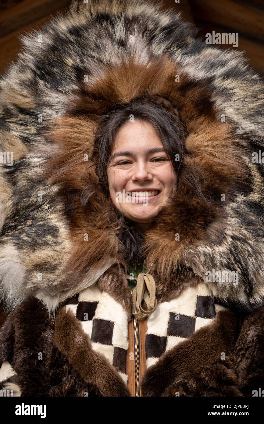An Athabaskan Girl poses in native costume at the Chena Indian Village ...