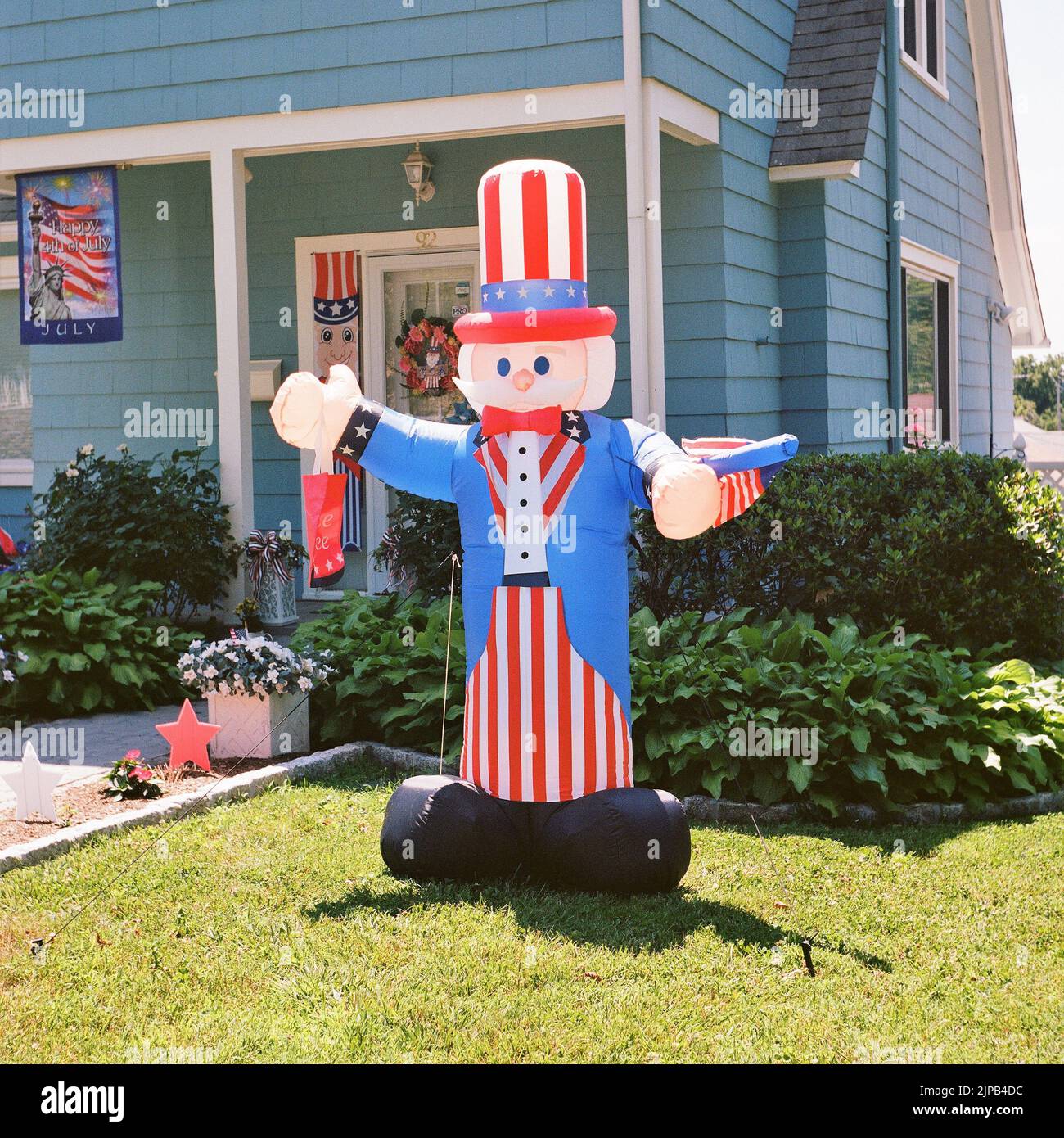 Inflatable Uncle Sam On Lawn In Front of House Stock Photo