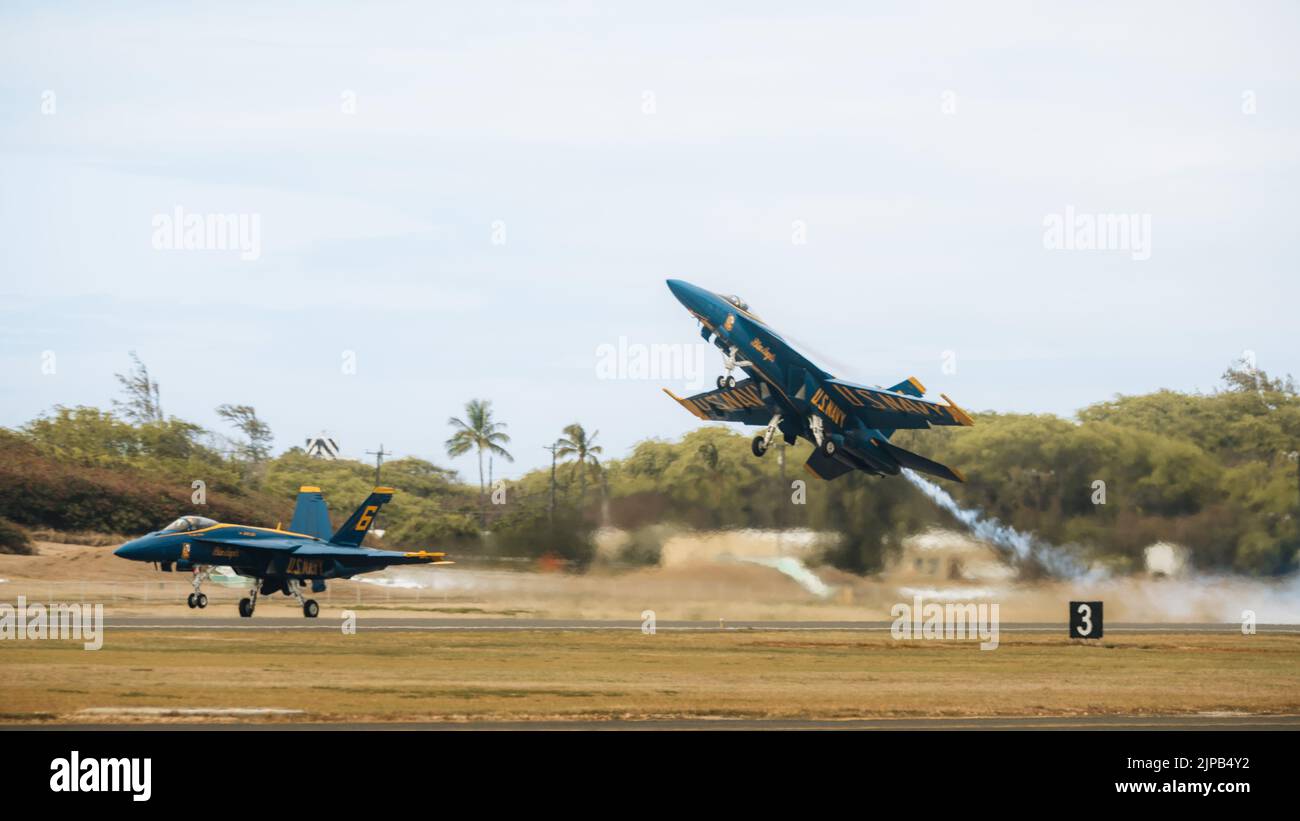U.S. Navy Blue Angels F/A-18 Super Hornet pilots take off at the 2022 Kaneohe Bay Air Show, Marine Corps Air Station Kaneohe Bay, Marine Corps Base Hawaii, Aug. 14, 2022. The air show provided an opportunity to demonstrate the capabilities of a Joint Force in the Indo-Pacific Region. The Kaneohe Bay Air Show, which contained aerial performances, static displays, demonstrations and vendors, was designed to express MCBH’s appreciation to the residents of Hawaii and their continued support of the installation. (U.S. Marine Corps photo by Cpl. Patrick King) Stock Photo