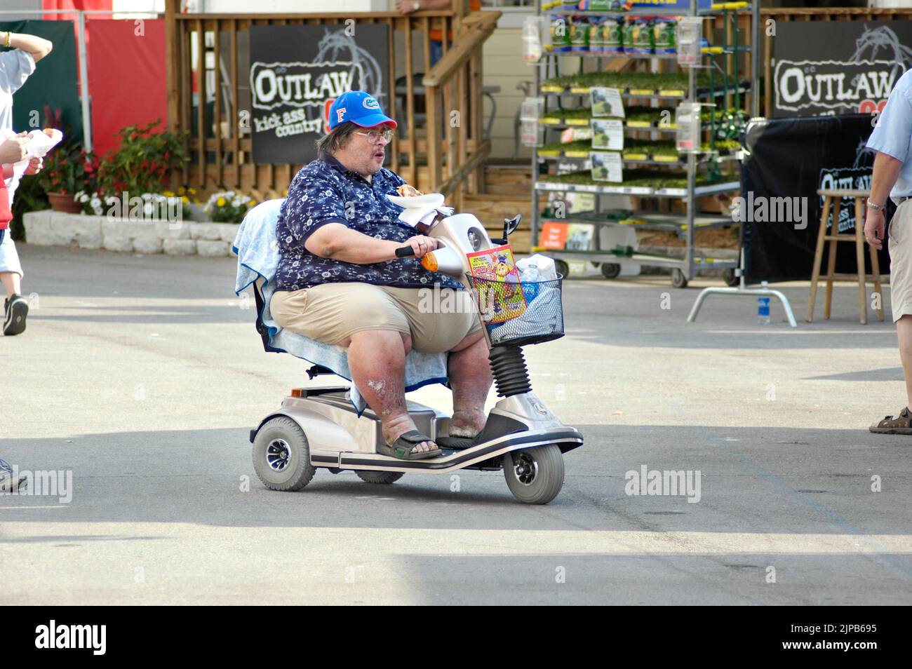 People confined to wheelchairs and walkers at the Florida State Fair