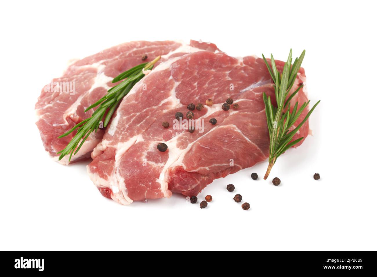 Raw meat with rosemary on a white background Stock Photo