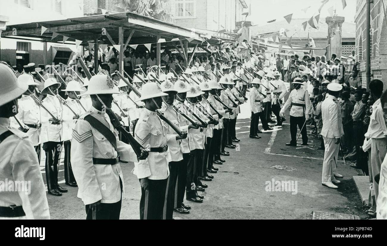 Black and white historical photograph showing a parade of police in ceremonial dress on February 7, 1974, Grenada's Independence Day when it became independent from the United Kingdom, Grenada, West Indies Stock Photo