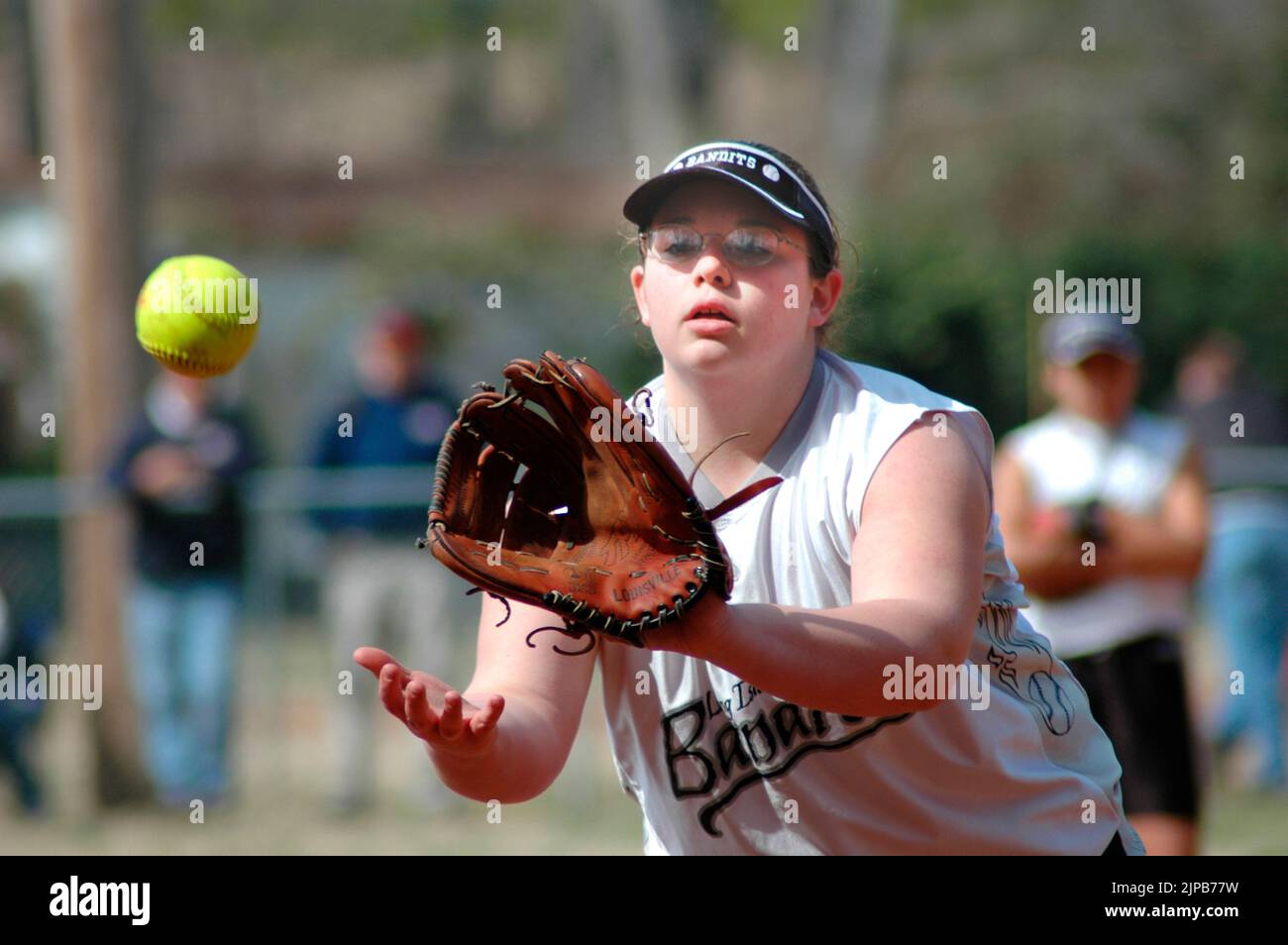 Youth and coaches on sports fields during spring sports, being coached