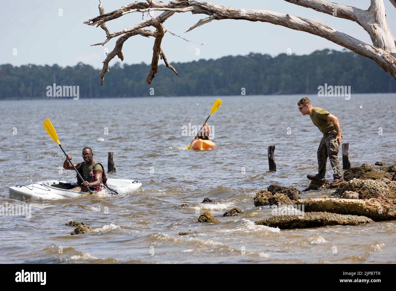 Camp Lejeune, North Carolina, USA. 29th July, 2022. Marines and sailors with the 26th Marine Expeditionary Unit compete in a kayak race during a field meet at Camp Lejeune, N.C. June 29, 2022. The field meet was hosted to build unit cohesion and camaraderie. Other events included a tug of war, vehicle push, combat fitness test relay, and volleyball. The physical activities were followed by a family day. Credit: U.S. Marines/ZUMA Press Wire Service/ZUMAPRESS.com/Alamy Live News Stock Photo