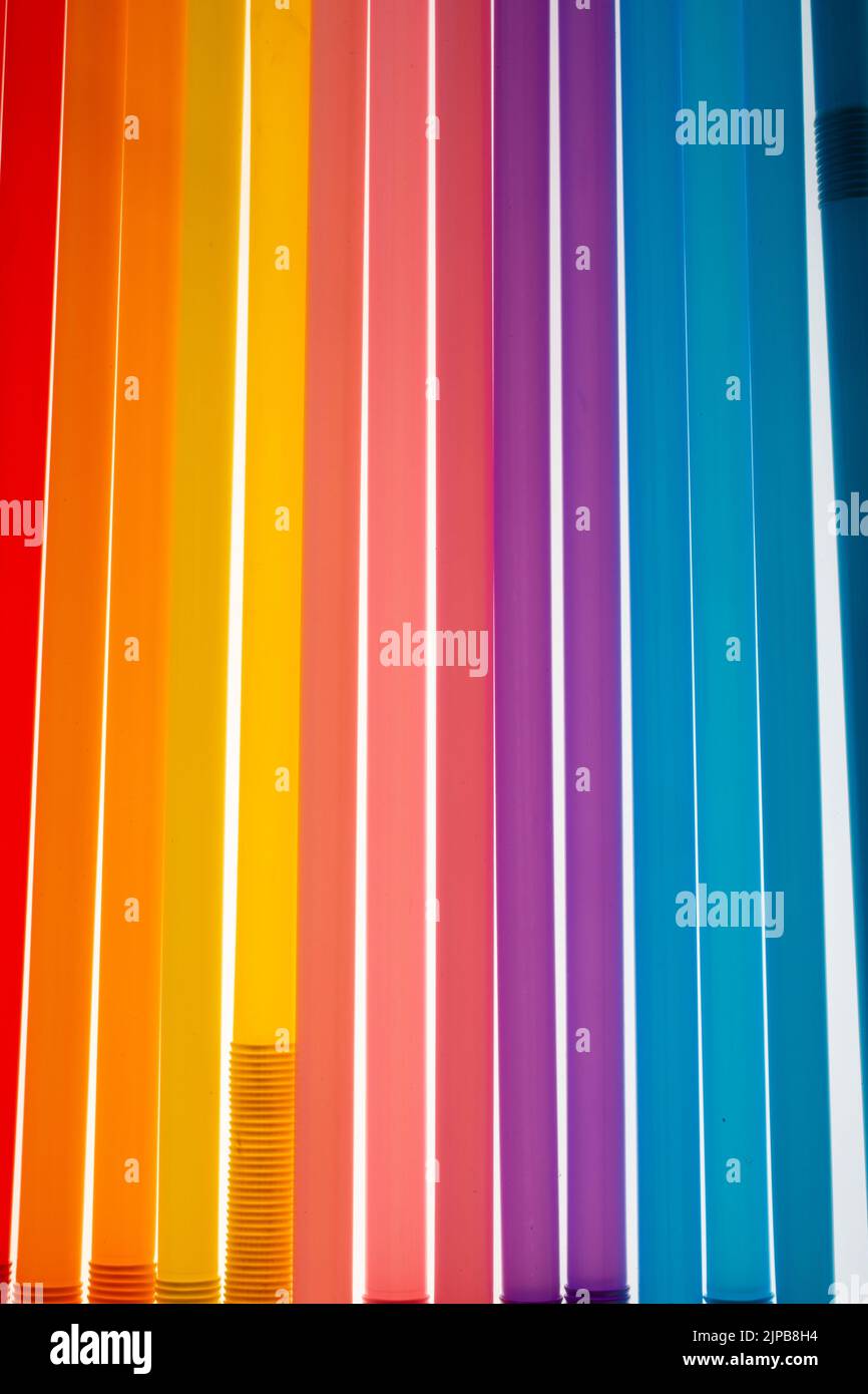 A colorful wall art with vertical lines of colorful stripes perfect