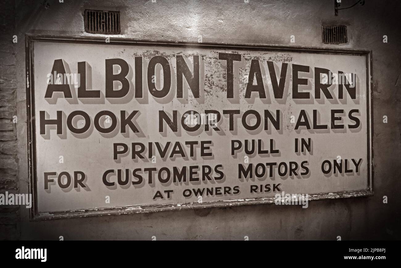 Historic English public house, the Albion Tavern, Hook Norton Ales sign - Private pull in, for customers motors only, at owners risk Stock Photo