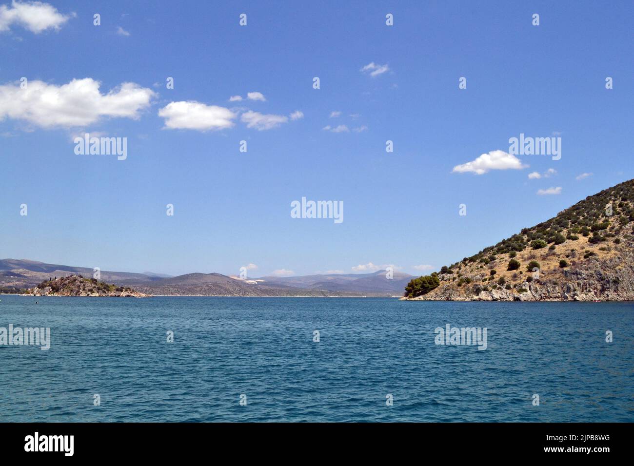 View of Romvi island and Koronisi island in Tolo, Greece. Stock Photo