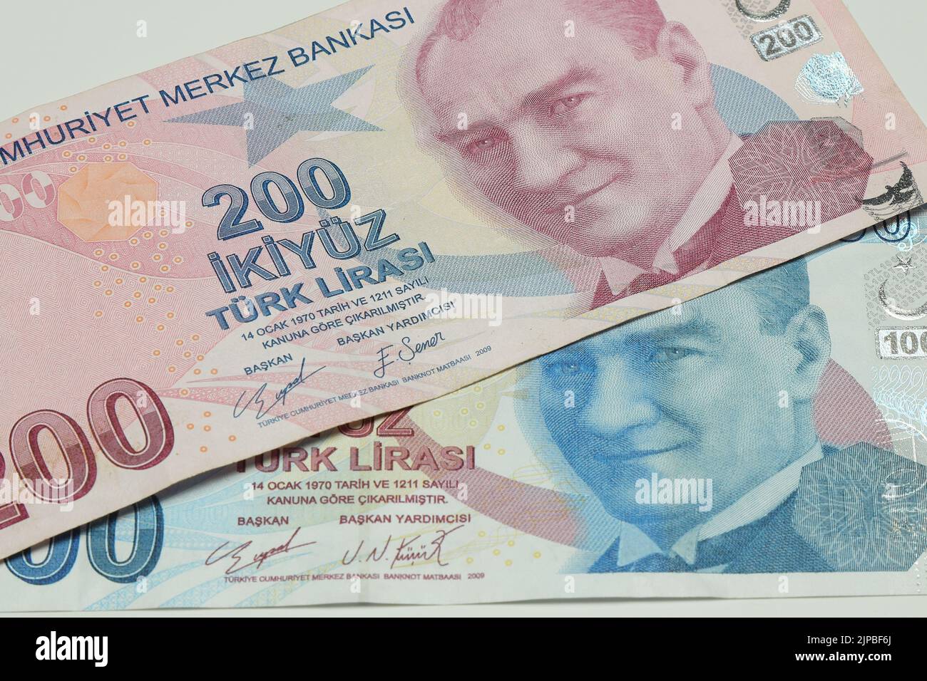 Turkish Lira banknotes of various color, pattern and value on white ...