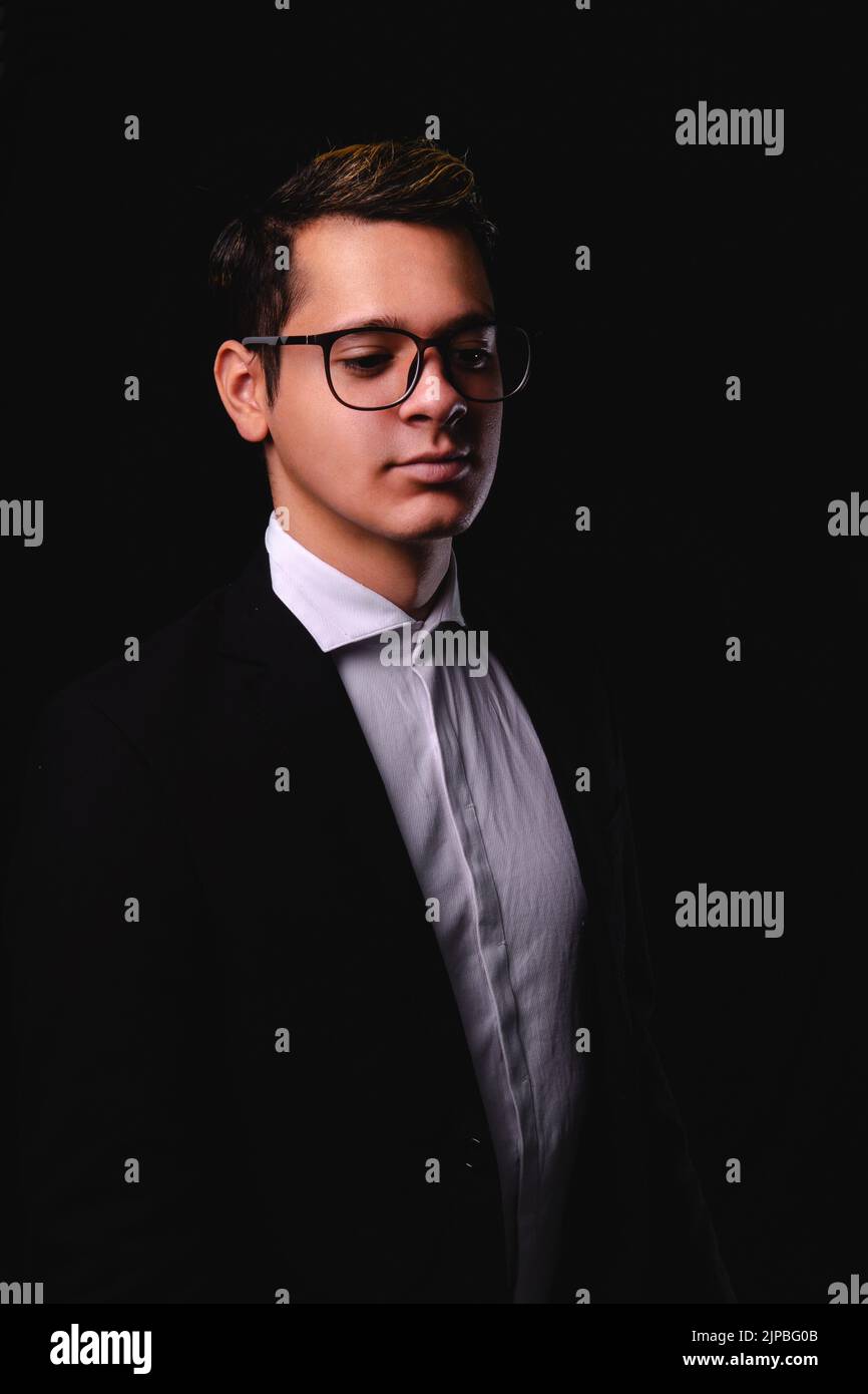Businessman on a black background. Man dressed in a suit, white shirt ...