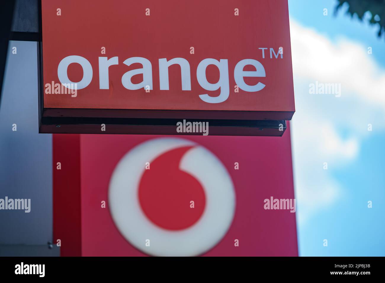 Bucharest, Romania - August 04, 2022: Logo of Orange, French telecommunications company and Vodafone, British telecommunications company is displayed Stock Photo