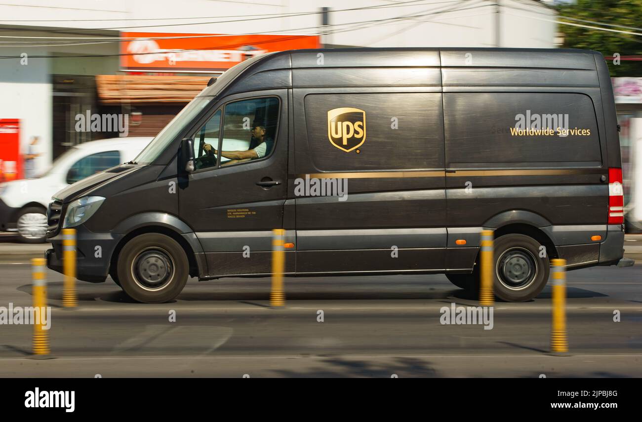 Bucharest, Romania - August 11, 2022: An UPS delivery van speeding through the traffic in Bucharest. This image is for editorial use only. Stock Photo