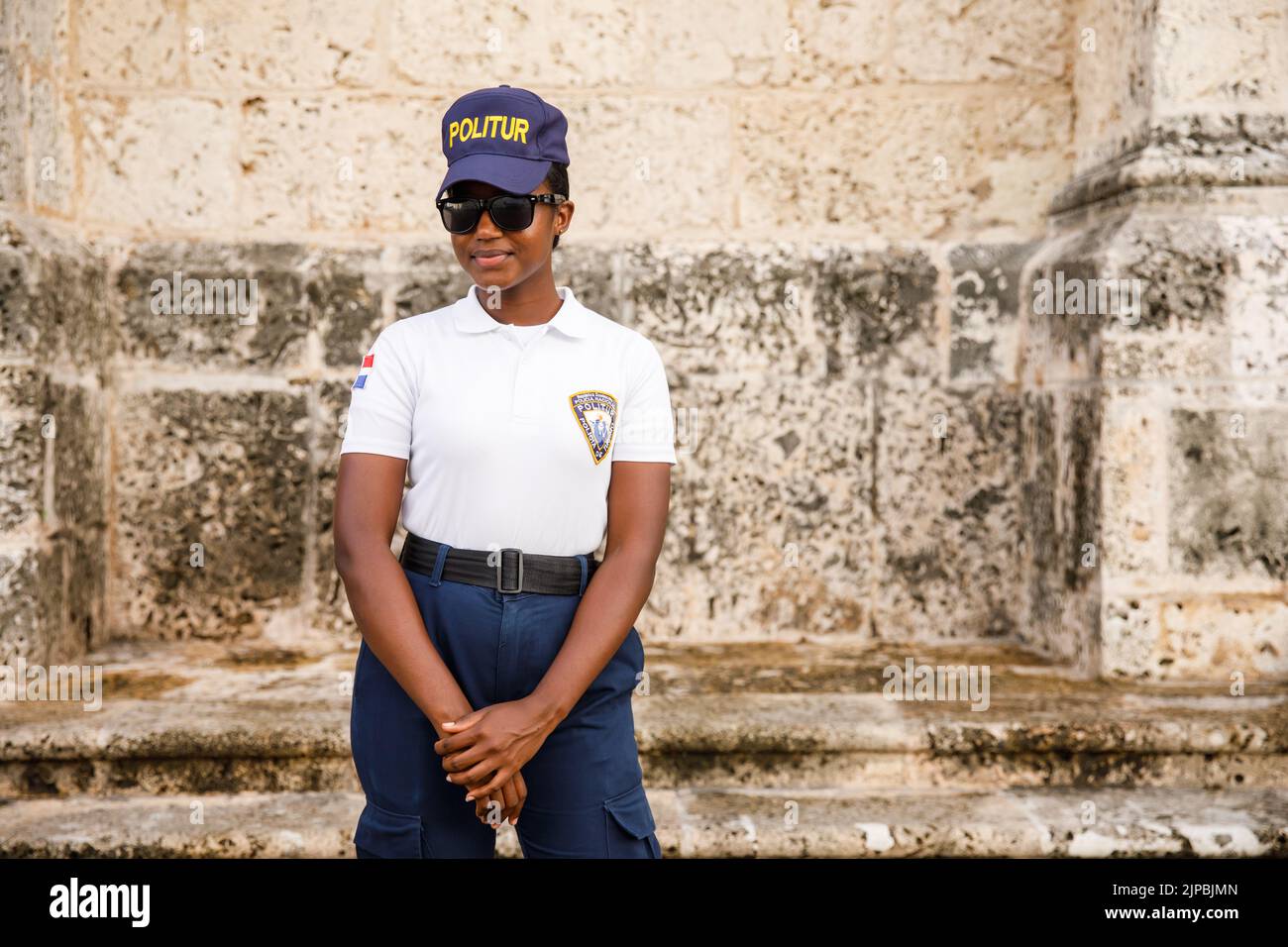 30.06.2022 Portrait of a smiling policewoman. in the Dominican Republic. Santo Domingo, Colonial Zone. Stock Photo