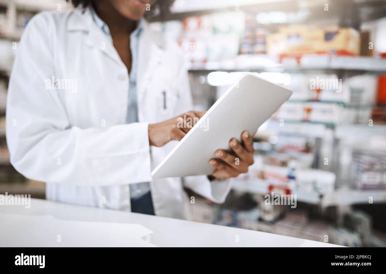 If we dont have it, well get it for you. an unrecognizable young female pharmacist working in a pharmacy. Stock Photo