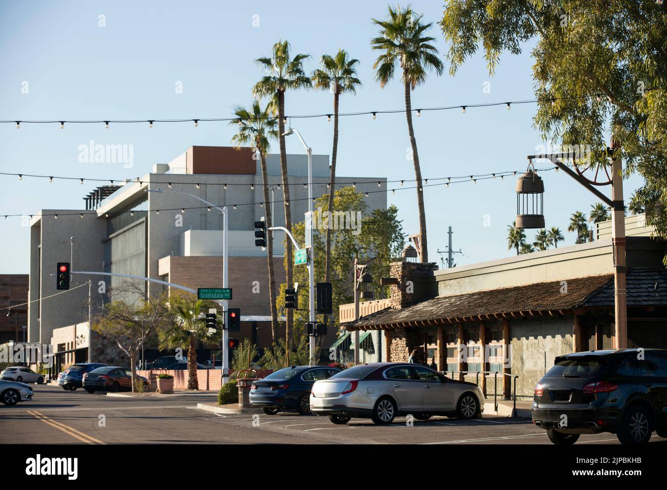 Late afternoon view of a light post framing the historic Old Town of