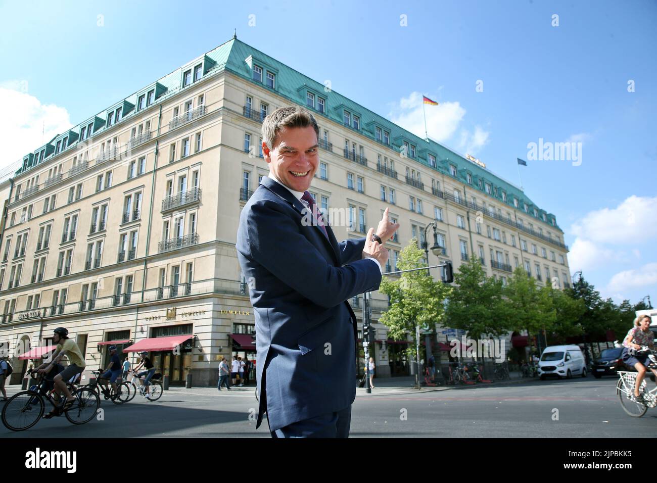 Berlin, Germany. 08th Aug, 2022. Michael Sorgenfrey, director of the Hotel Adlon, stands in front of the luxury hotel on Pariser Platz. Opened in 1907 in imperial times. Exuberant parties in the Golden Twenties. The Hotel Adlon was the scene of history. With its reopening, it has written history itself. (to dpa KORR.: 'Luxury hotel and landmark - 25 years Hotel Adlon') Credit: Wolfgang Kumm/dpa/Alamy Live News Stock Photo