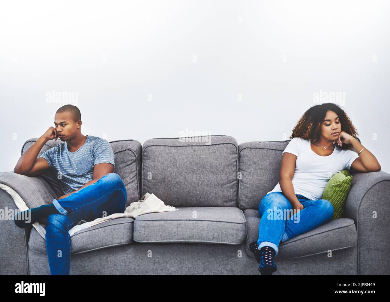 Theres a big wall between them. a young couple having relationship problems at home. Stock Photo