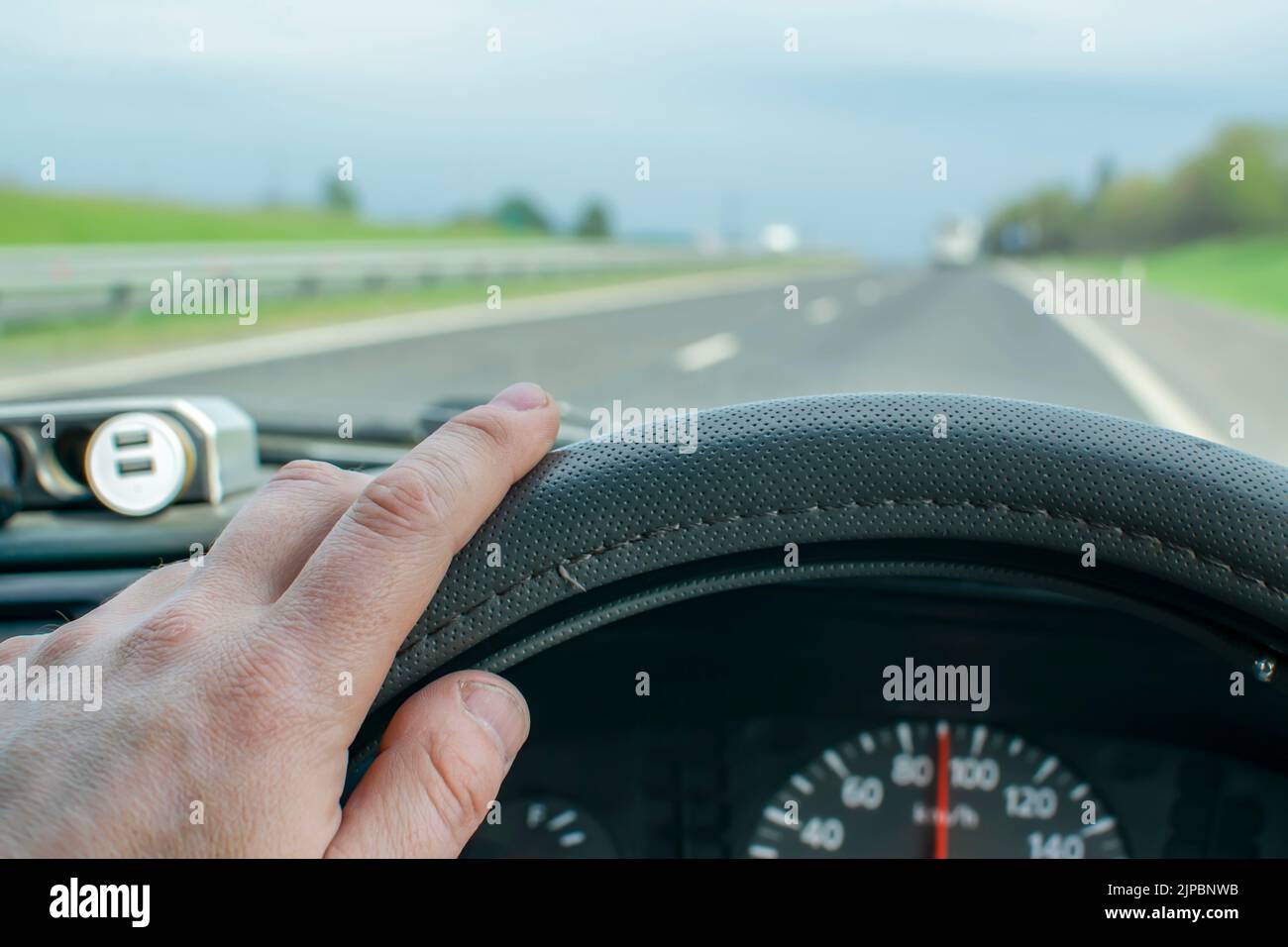 Man hand on steering wheel hi-res stock photography and images - Alamy