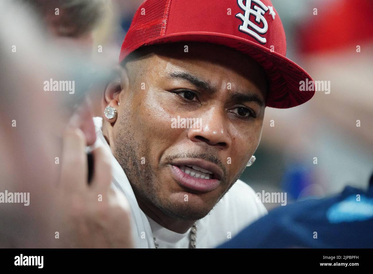 St. Louis, United States. 17th Aug, 2022. Rapper Nelly talks to fans