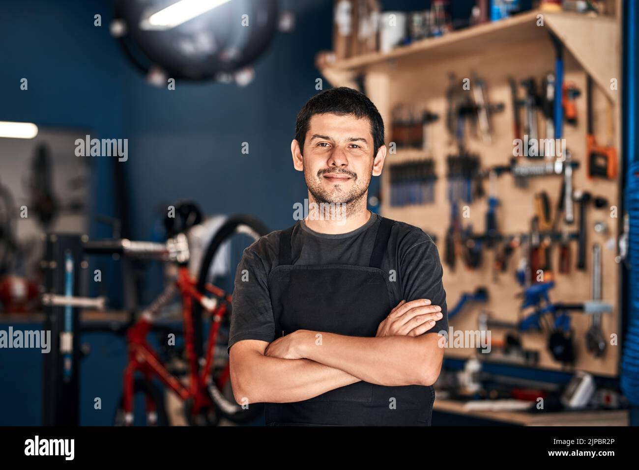 The authority in bikes. a man working in a bicycle repair shop Stock