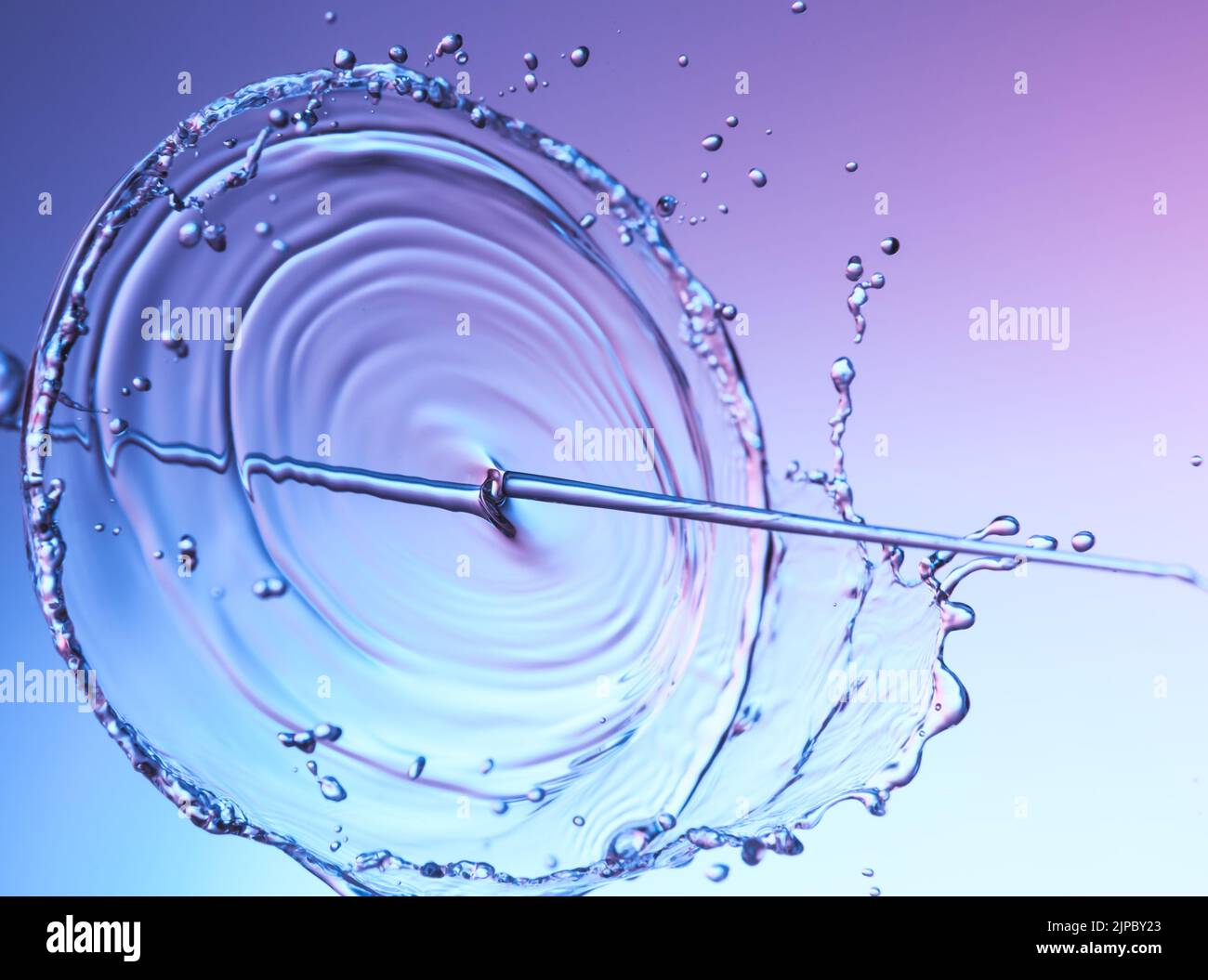 Clear water liquid splash on a red blue background Stock Photo