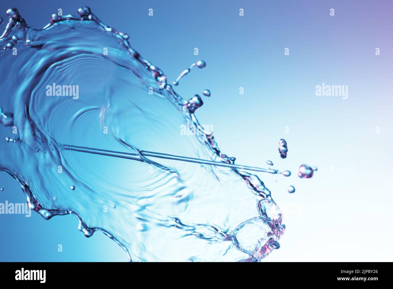 Clear water liquid splash on a blue background Stock Photo