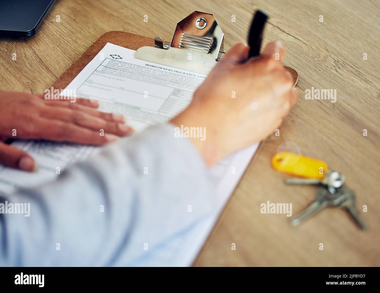 . Signing contract, document and paper closeup of banker, client or worker, writing or filling out information on insurance or loan form. Hands of Stock Photo