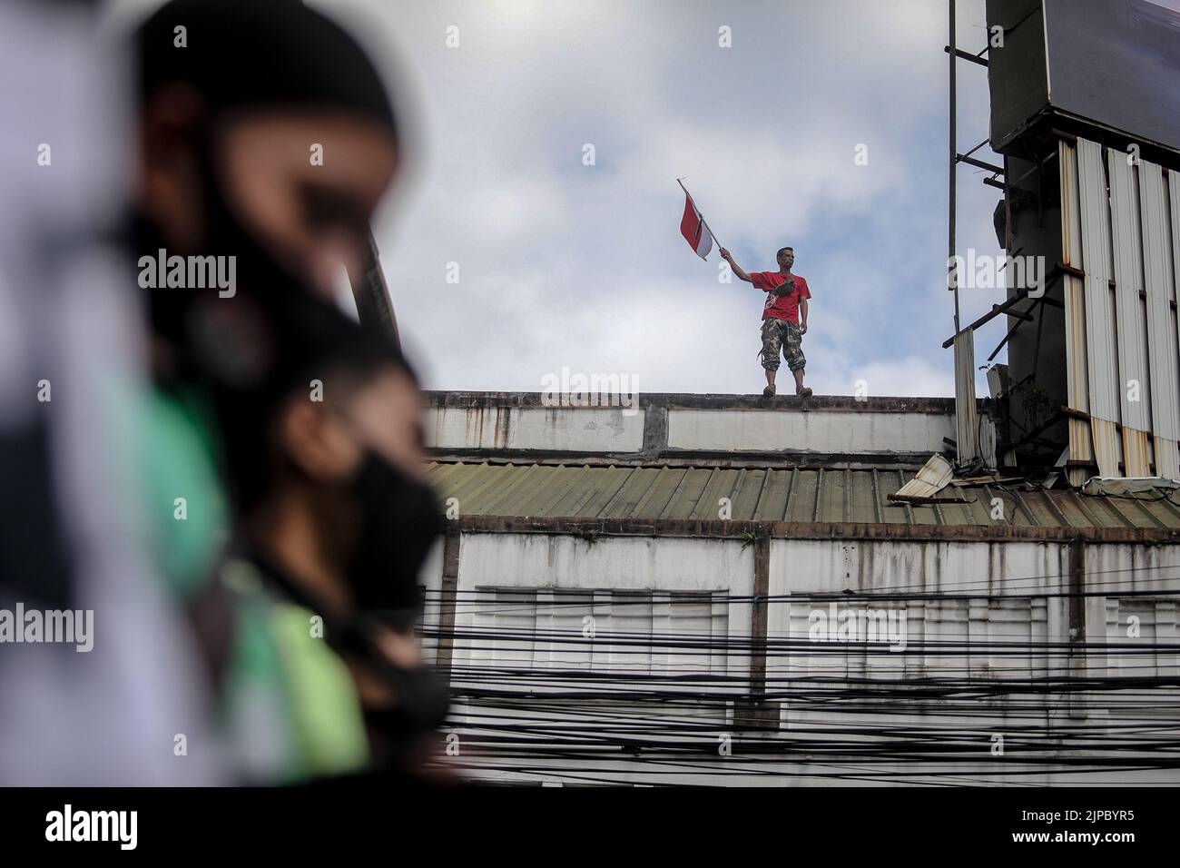 Bandung, West Java, Indonesia. 17th Aug, 2022. People raised flags ...