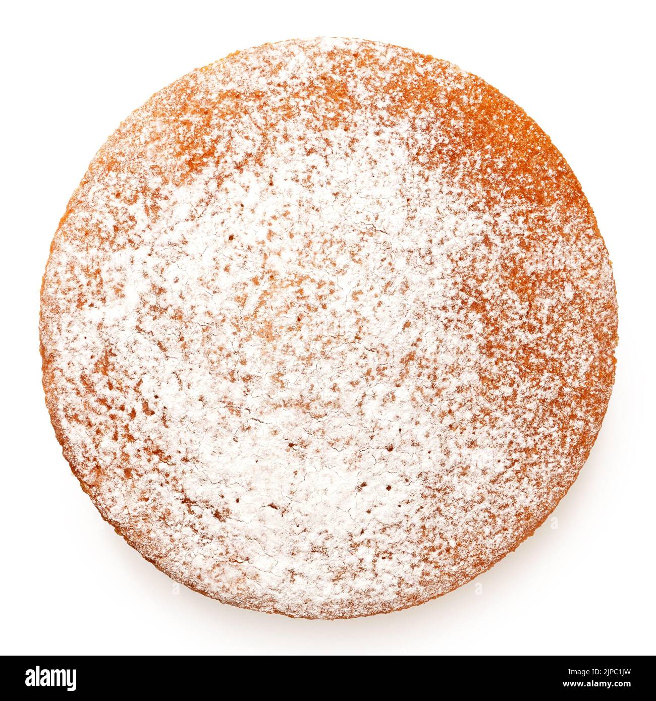 Whole lemon sponge cake with icing sugar topping isolated on white. Top view. Stock Photo