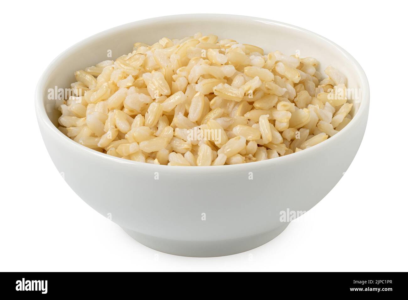 Brown cooked rice in a white ceramic bowl isolated on white. Stock Photo
