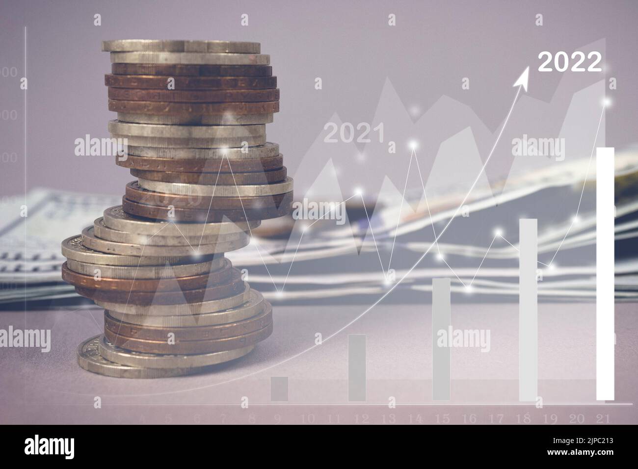 Stacks of gold money coin with profit graph, growth up, success on blur background, concept saving money. Stock Photo