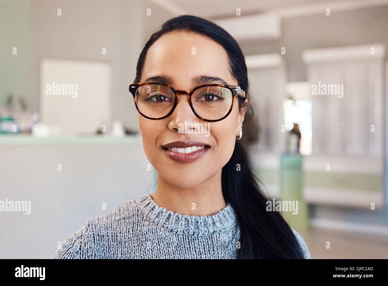 New glasses at optometrist checkup, buying eyewear and fitting frames at a shop. Closeup