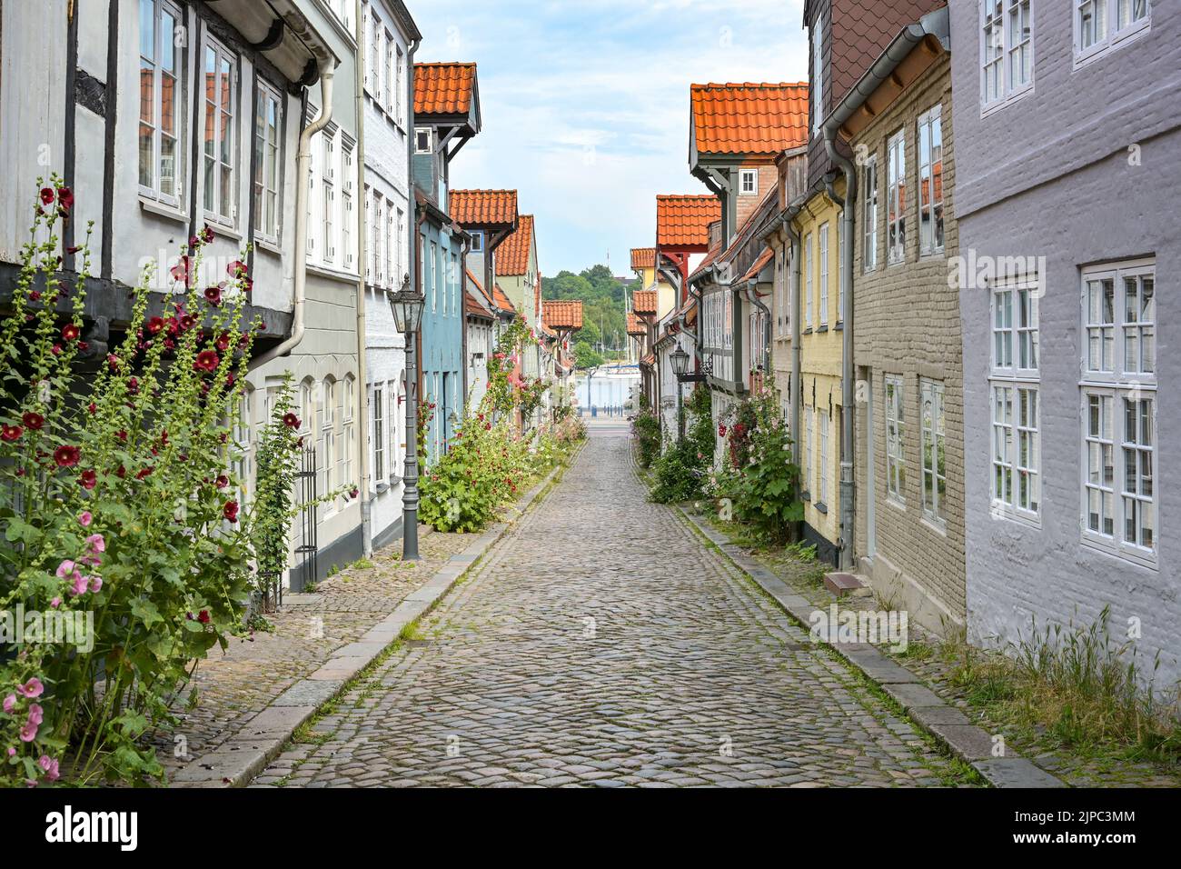 Old town of Flensburg, narrow cobblestone alley with historic