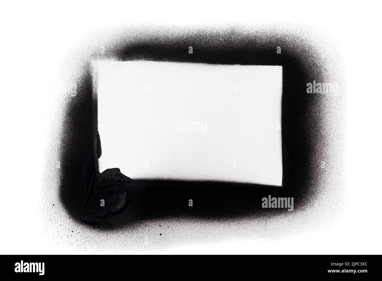 Close-up of a white rectangle made with black spray paint and stencil. Isolated on white background. Copy space. Stock Photo