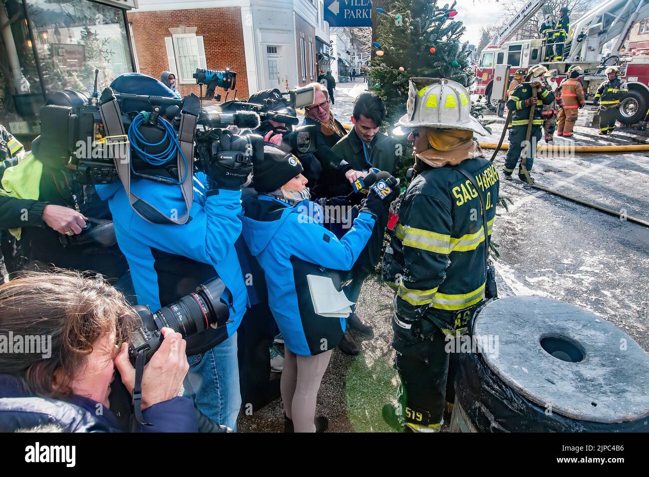 Sag Harbor First Assistant Chief Bruce Schiavoni holds an impromptu press conference as firefighters pick up their hoses as on Friday morning, Decembe Stock Photo