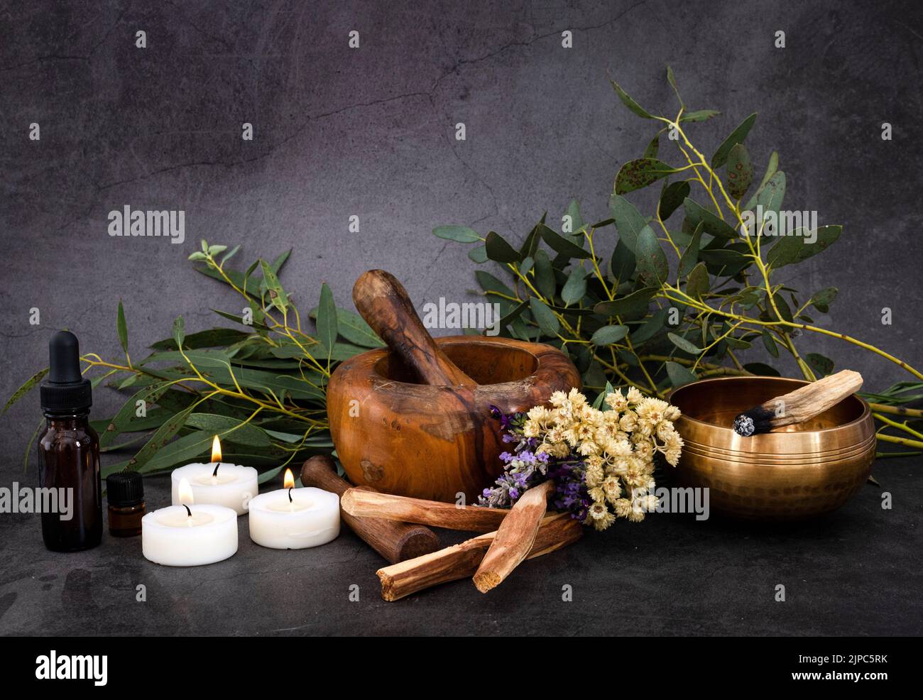 palo santo and mortars in front of dark background Stock Photo