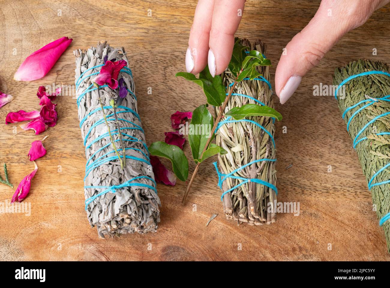 white sage incense group in front of white background Stock Photo