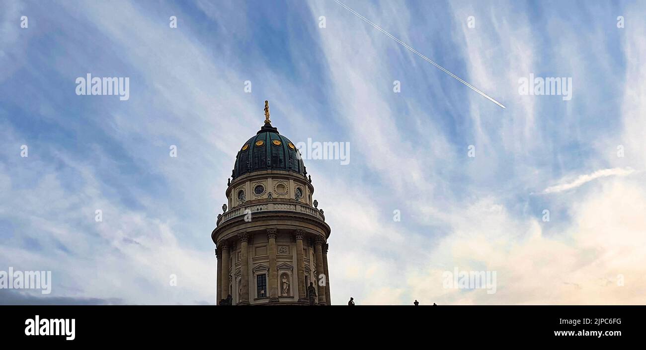 The French Church of Friedrichstadt against the sky in Berlin, Germany Stock Photo