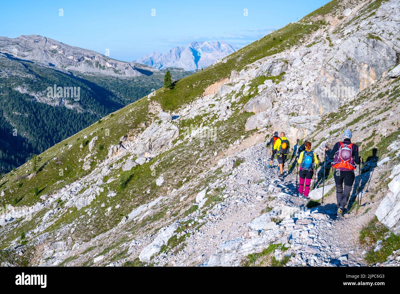 Group of hikers ascending the mountain in Dolomites Stock Photo - Alamy