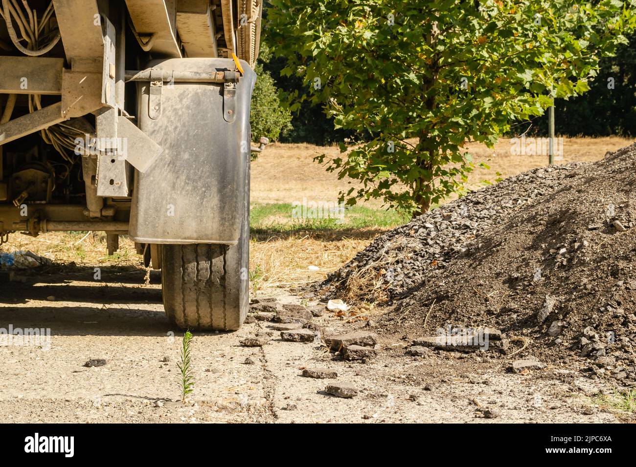 Parked truck trailers. The wheels of a truck trailer parked in a nearby
