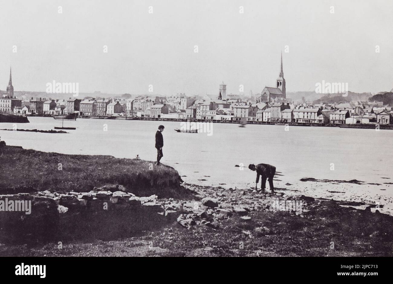 Wexford, County Wexford, Ireland, seen here from the opposite shore in the 19th century.  From Around The Coast,  An Album of Pictures from Photographs of the Chief Seaside Places of Interest in Great Britain and Ireland published London, 1895, by George Newnes Limited. Stock Photo