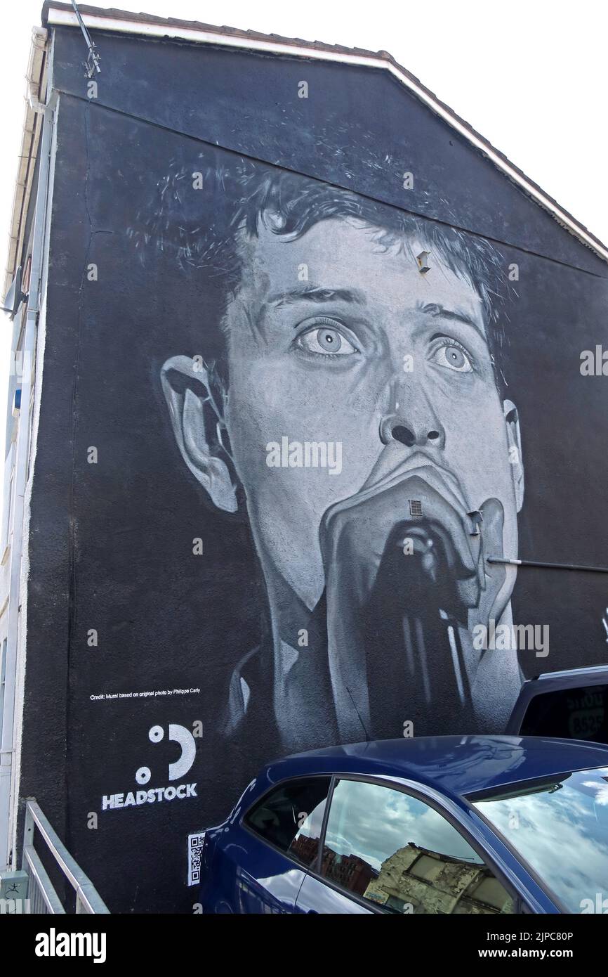 Iconic Port Street, Ian Curtis mural by @Akse_P19 in Manchester Northern Quarter NQ4, overwritten by Amazon Music rapper Aitch, 16th August 2022 Stock Photo