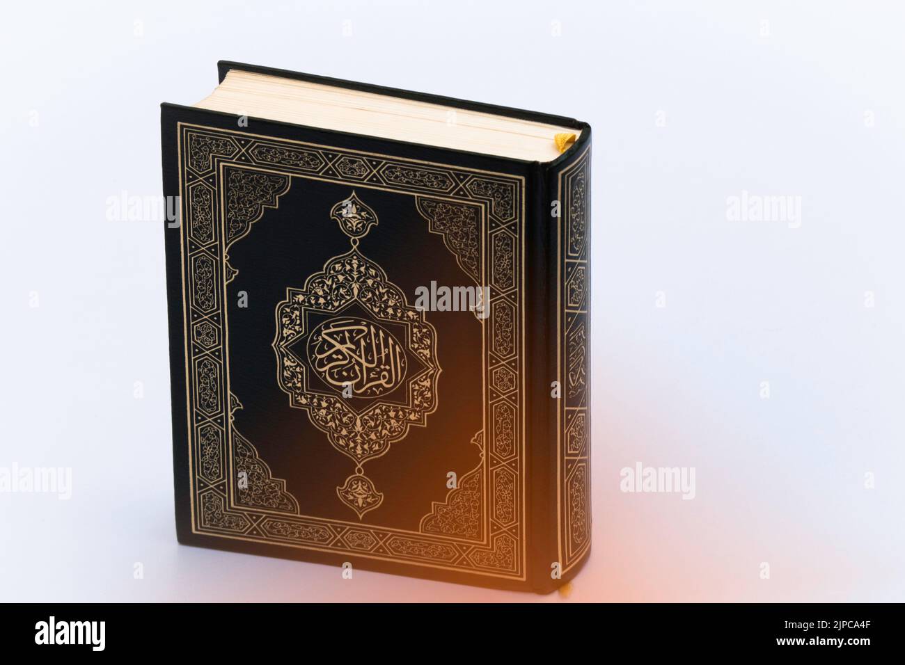 A Closeup Shot Of Holy Al Quran With Written Arabic Calligraphy Meaning Of Al Quran Stock Photo