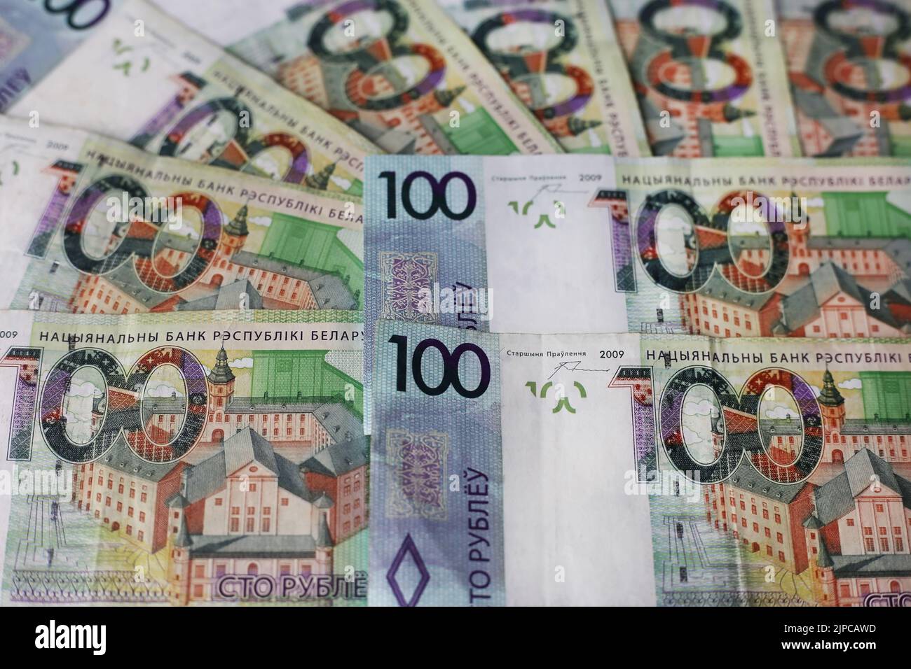 Banknotes of 100 Belarusian rubles laid out, close-up Stock Photo