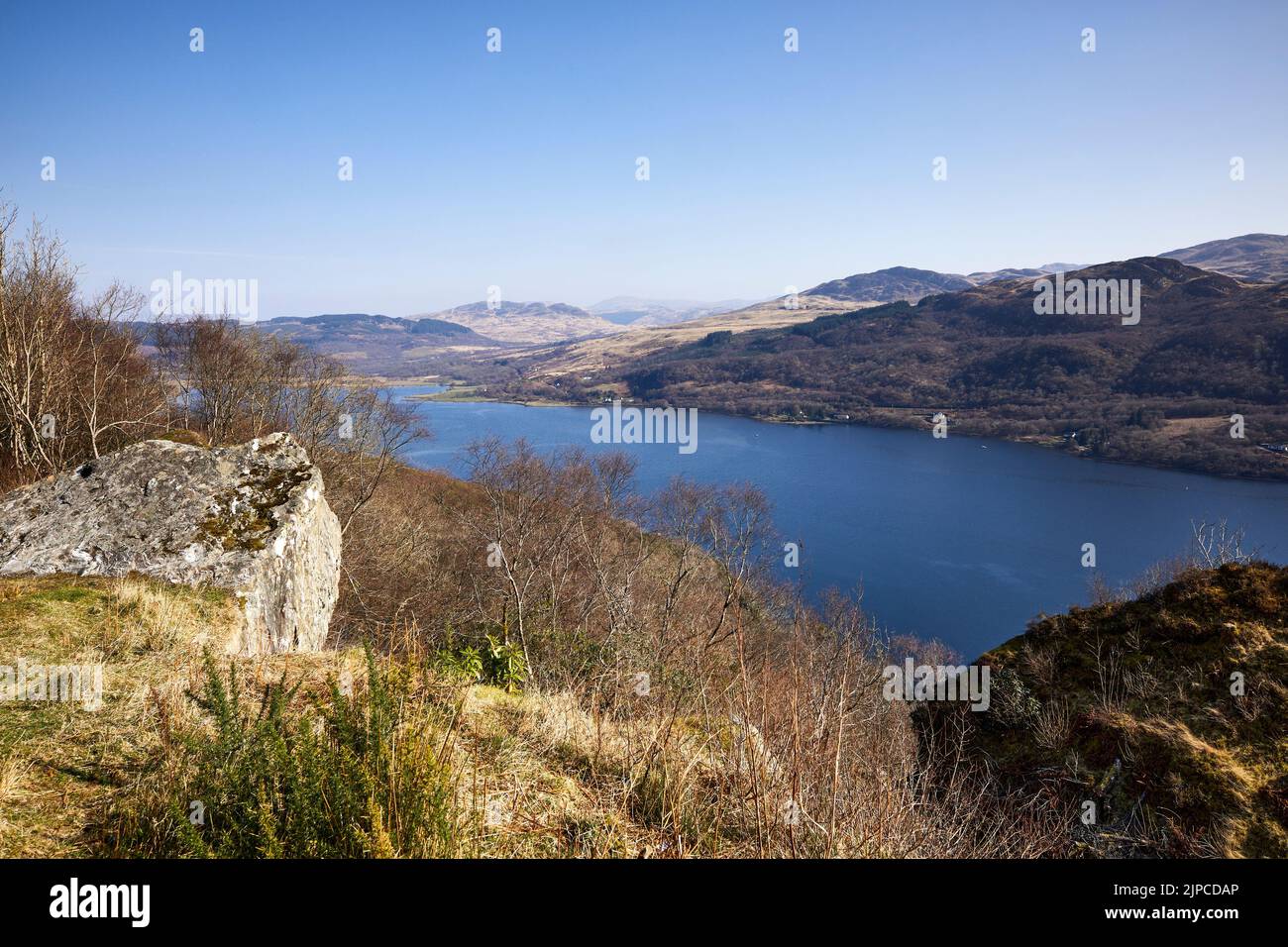 A bright and crisp springtime view looking north towards Auchebbreck and Ormidale from viewpoint by Creagan Dubh on the A8003. Across Loch Ruel Stock Photo