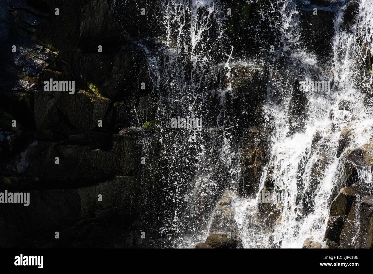 The close-up view of waterfalls flowing through the rocks Stock Photo