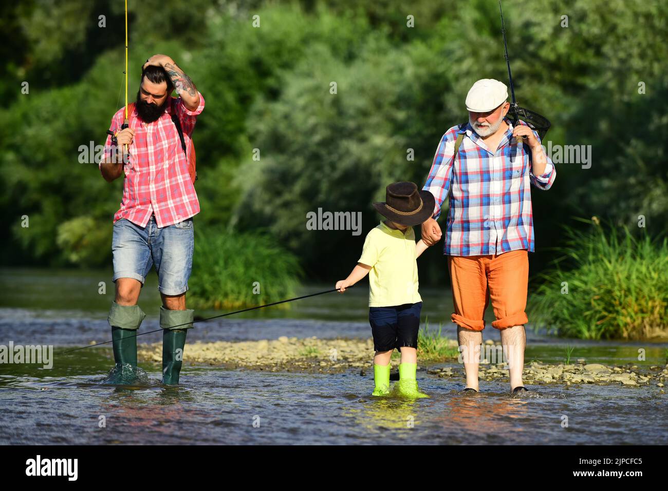 Family man father son boy child fishing river lake stream hi-res