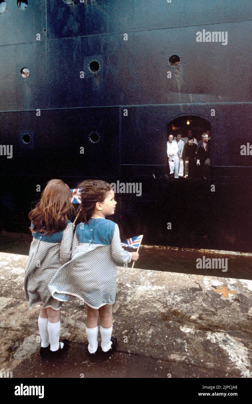 File photo dated 12/05/82 of Elouise, 4, (left) and Sasha Philips, 6, of Wales, on the quayside at Southampton to wave goodbye to their father, is in the centre of the hatchway, infantryman Jed Philips, of 205/216 Airborne Signal Squadron part of the Falklands task force. Consumer Prices Index (CPI) inflation reached 10.1 percent last month, the biggest jump in the cost of living since February 1982, when CPI reached 10.4 percent, according to estimates. Issue date: Wednesday August 17, 2022. Stock Photo