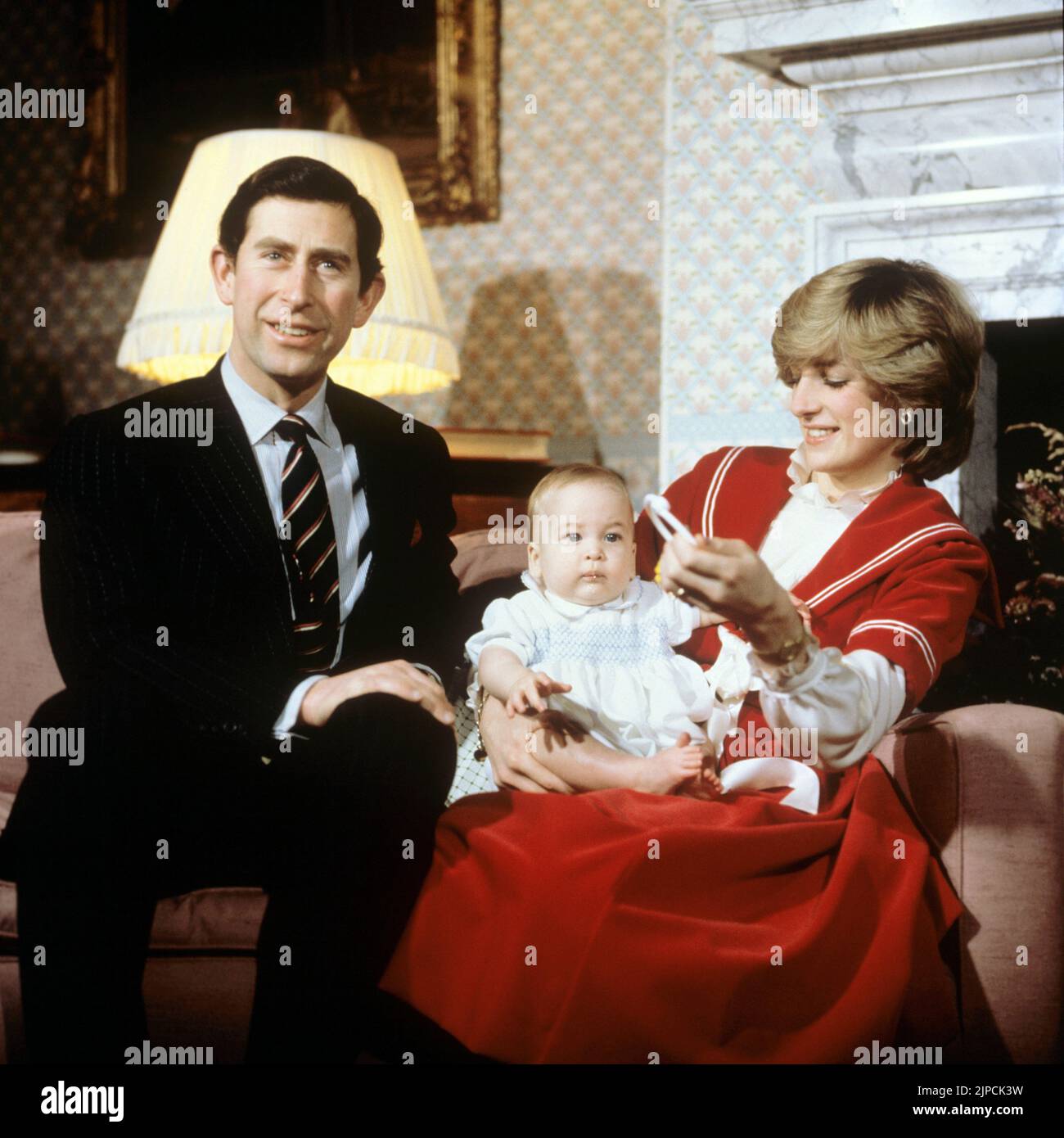 File photo dated 22/12/82 of Prince Charles, the Princess of Wales and Prince William play with a rattle on the sofa at Kensington Palace London. Consumer Prices Index (CPI) inflation reached 10.1 percent last month, the biggest jump in the cost of living since February 1982, when CPI reached 10.4 percent, according to estimates. Issue date: Wednesday August 17, 2022. Stock Photo